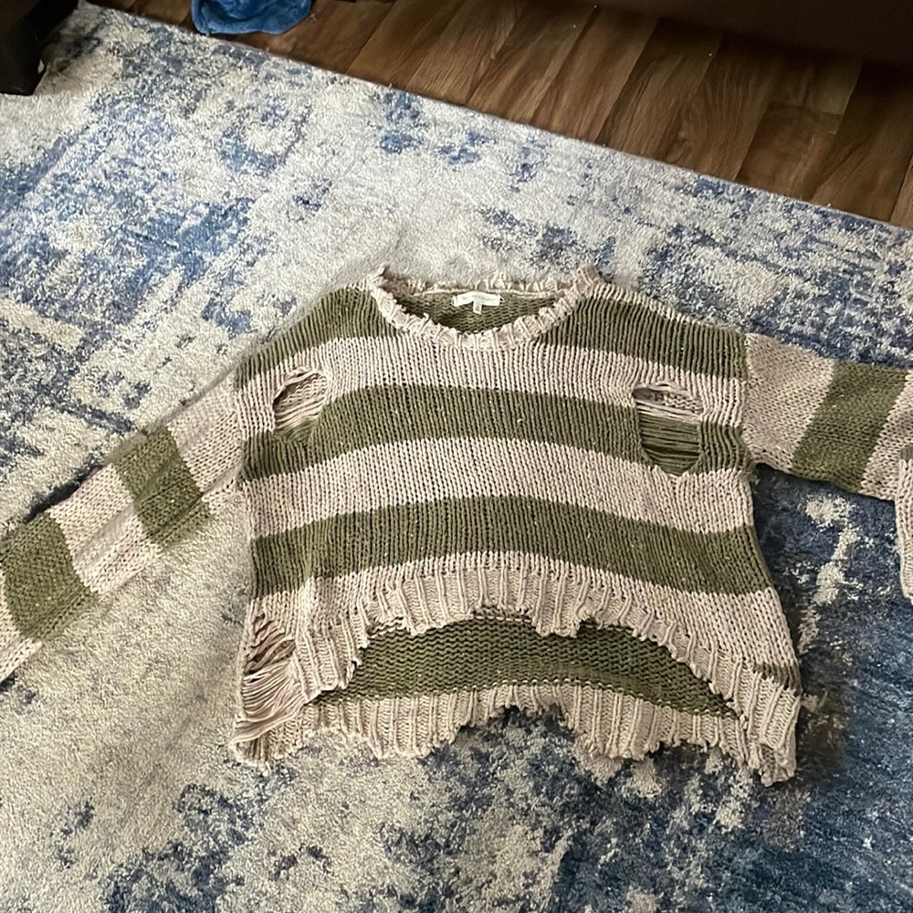 Green and white striped sweater